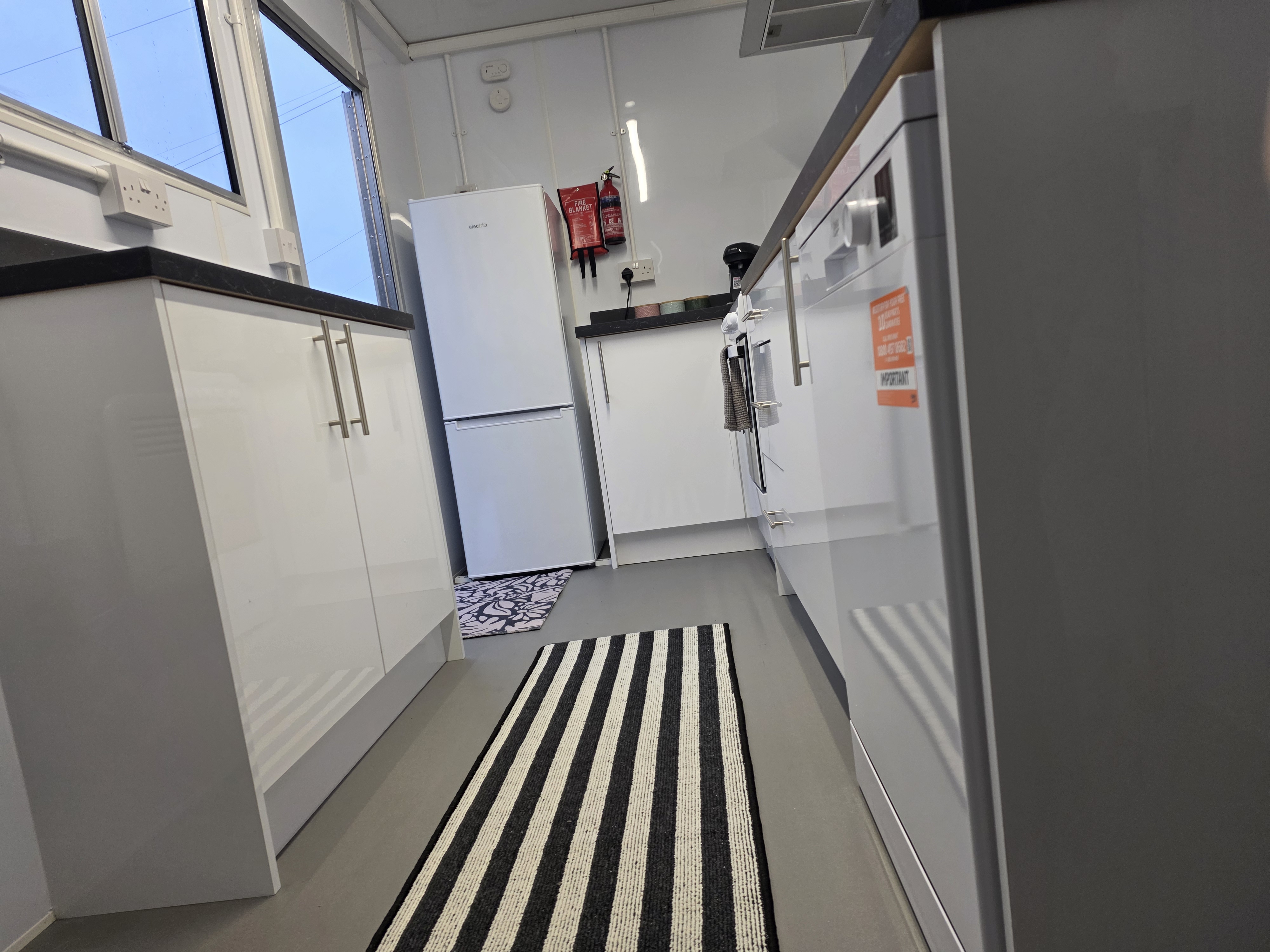 Kitchen pod — appliance and storage detail