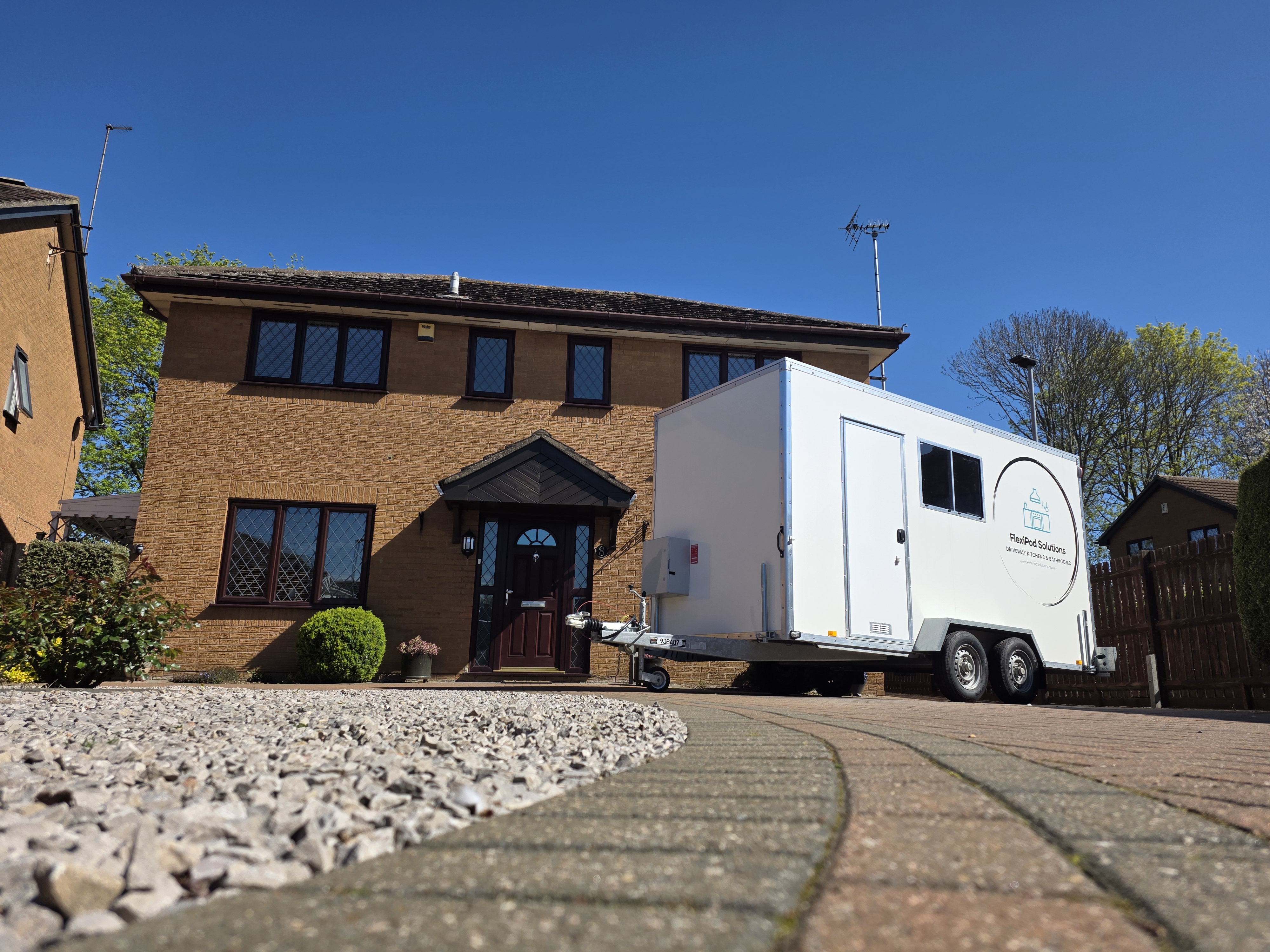 FlexiPod exterior — side profile on driveway